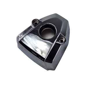 A chrome Cover, Ignition/Coil, LH [X-1] by Polaris with a central circular opening and two side holes, likely for Victory motorcycles, shown against a white background.
