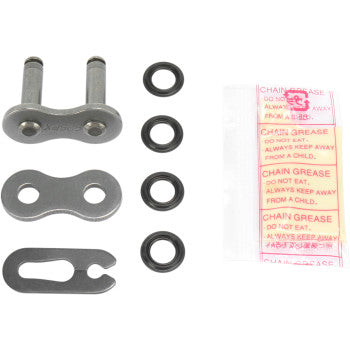 The 525 PX Series Clip Connecting Link by Parts Unlimited, rubber O-rings, a metal tool, and a CHAIN GREASE DO NOT EAT packet are arranged on a white background.