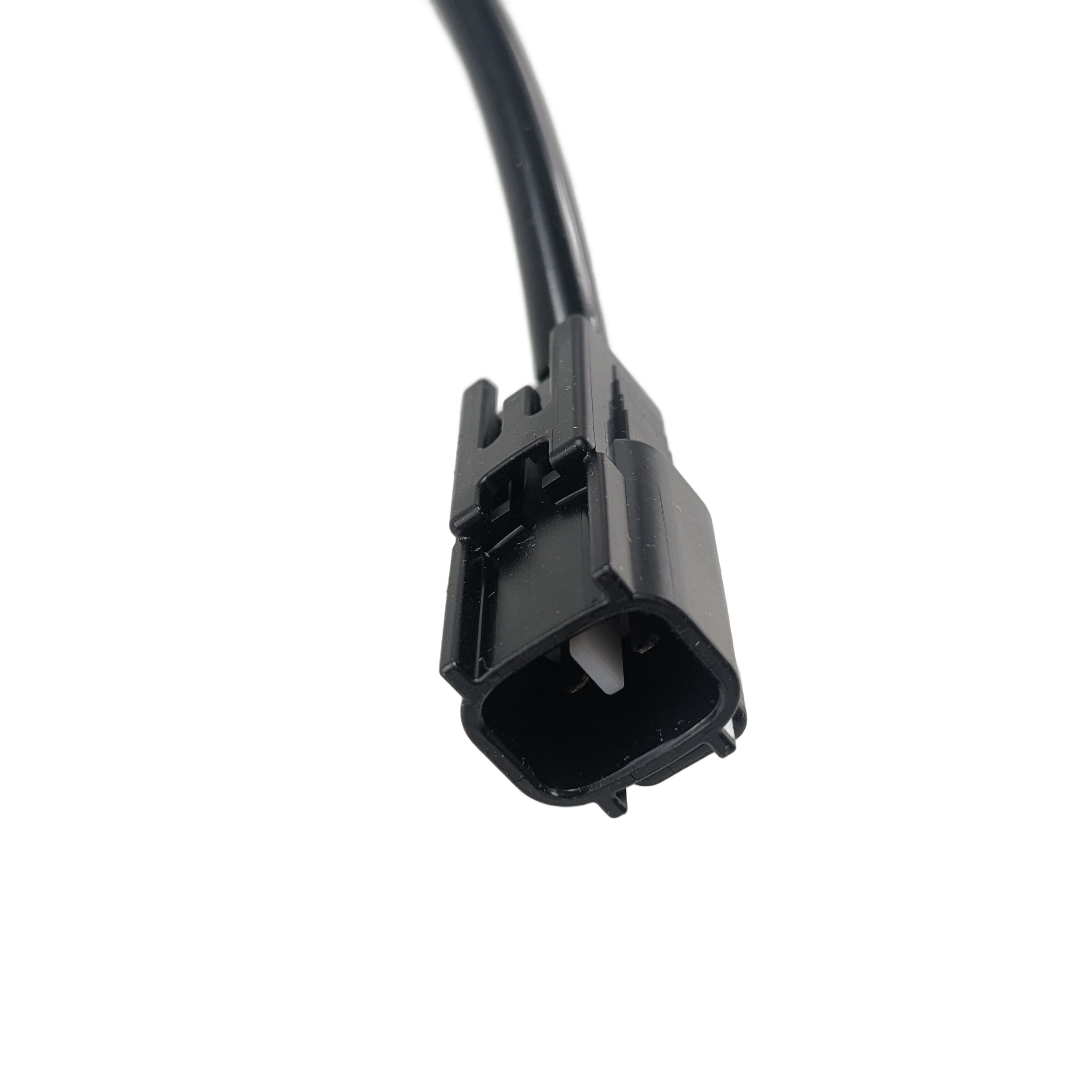 Close-up of the black Kawasaki Coil-Pulsing with wire attached, displaying its rectangular end and metal contacts—a vital Kawasaki OEM part for off-road vehicles and UTV accessories.