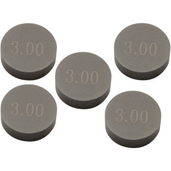 Five round, flat, gray Valve Shims (9.48 mm x 3.00 mm, 5 pack by Prox) are arranged loosely. Each disc is engraved with "3.00", highlighting its precision-machined quality and superior durability.