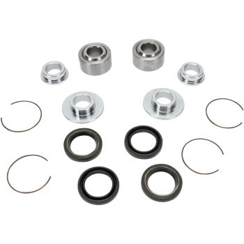 The Yamaha Shock Bearing Rear by Pivot Works includes PTFE spherical bearings, metal washers, circular clips, and rubber seals for rear shock rebuilds, all neatly arranged on a white background.