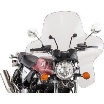 A red and black motorcycle, viewed from the front, features a large clear Enterprise Windshield by Slipstreamer on the handlebars, along with round mirrors, a headlight, and orange turn signals.