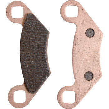Two Sintered Brake Pads by All Balls are shown: one side reveals the dark friction material, while the other displays the plain metal backing with two circular indents. Both feature a curved shape and holes at each end.