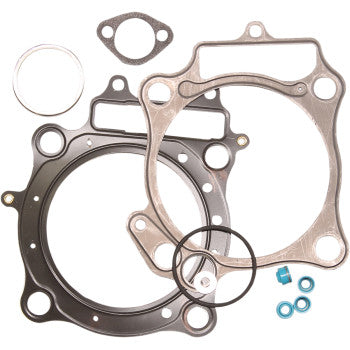 Set of metal and rubber gaskets including head gasket, seals, and blue metal washers for Honda engine top end repair.
