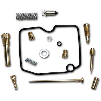 Assorted brass carburetor repair parts including springs, jets, needle, and black gasket seal arranged on white background.