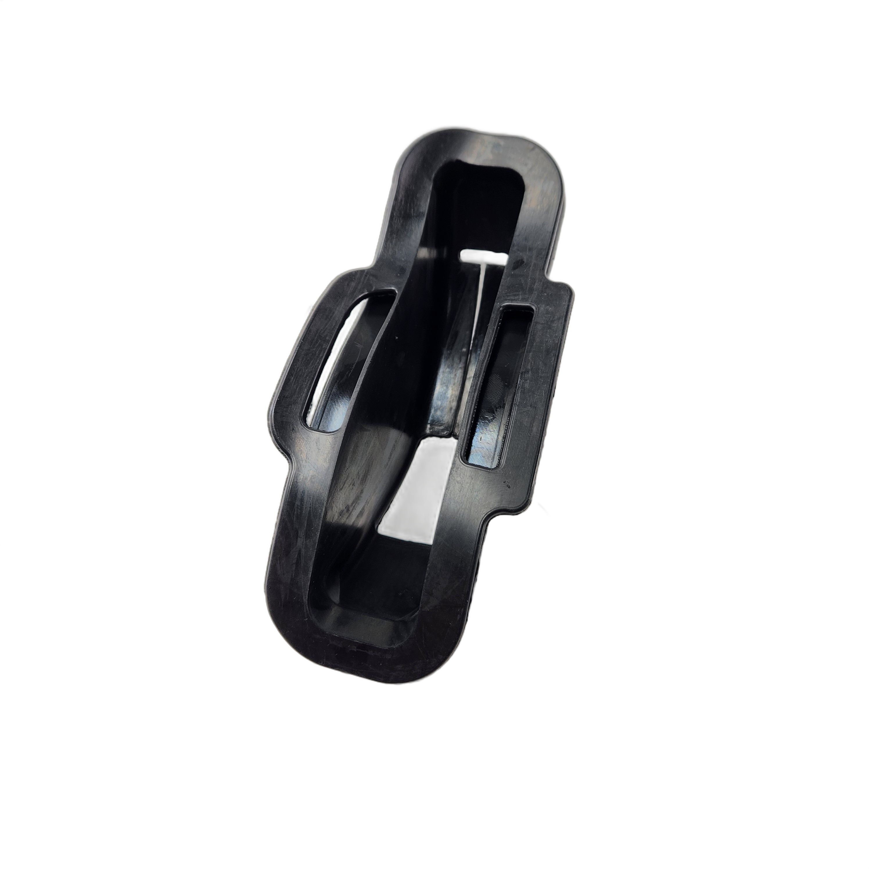 Black plastic handle lever cover with a rectangular shape and curved edges, featuring a central slot and raised sides.