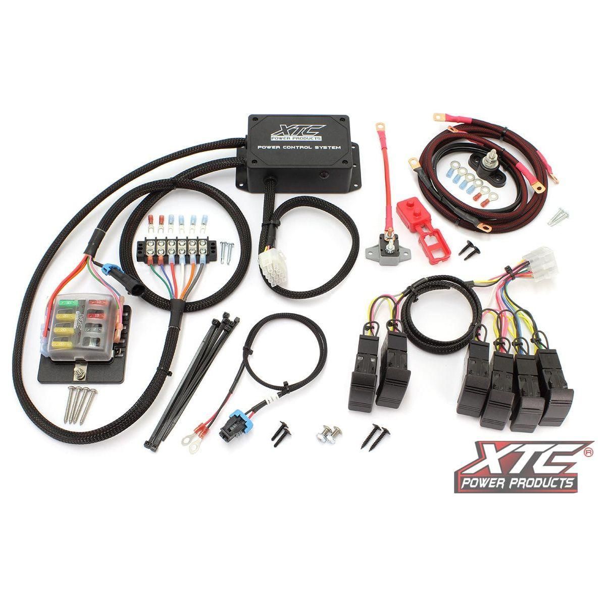Plug N Play Power Control 6 Switch Not Included Kaw by XTC Power, featuring a wiring kit with control module, wires, relays, fuses, fuse block, connectors, strobe rocker switch, zip ties, screws, and XTC Power logo on a white background.