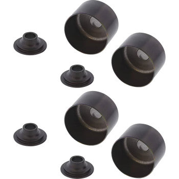 Four black cylindrical metal cups from the Polaris Shim Conversion Kit by Hot Cams, designed as valve shims, are paired with matching rubber gaskets and arranged together on a white background. Each cup is placed next to its gasket.