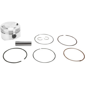 The Yamaha Piston Kit 83.50 mm by Wiseco includes a shiny metal piston, a cylindrical pin, two circular clips, and four assorted piston rings—made in the USA and displayed on a white background.