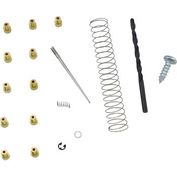 The Yamaha Jet Kit Stage 1/2 by Dynojet, shown on a white background, includes various small mechanical parts ideal for stock engine repairs or assembling modified pipes to boost power.