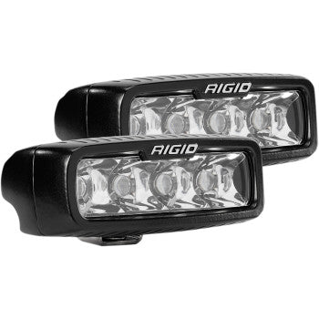 Two black rectangular SR-Q Pro Light Spot Pair LED bars by Rigid Industries, featuring clear polycarbonate lenses and cast aluminum housing, each with four bulbs, are placed side by side against a white background.