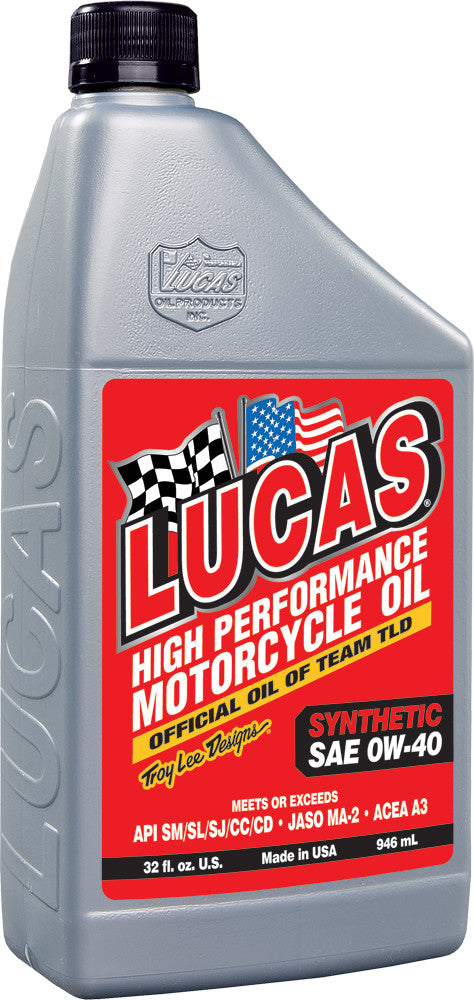 A gray plastic 1 qt bottle of Lucas Oil Synthetic High Performance Engine Oil 0W40 features a red label with checkered and American flags, designed to reduce engine noise and extend engine life.