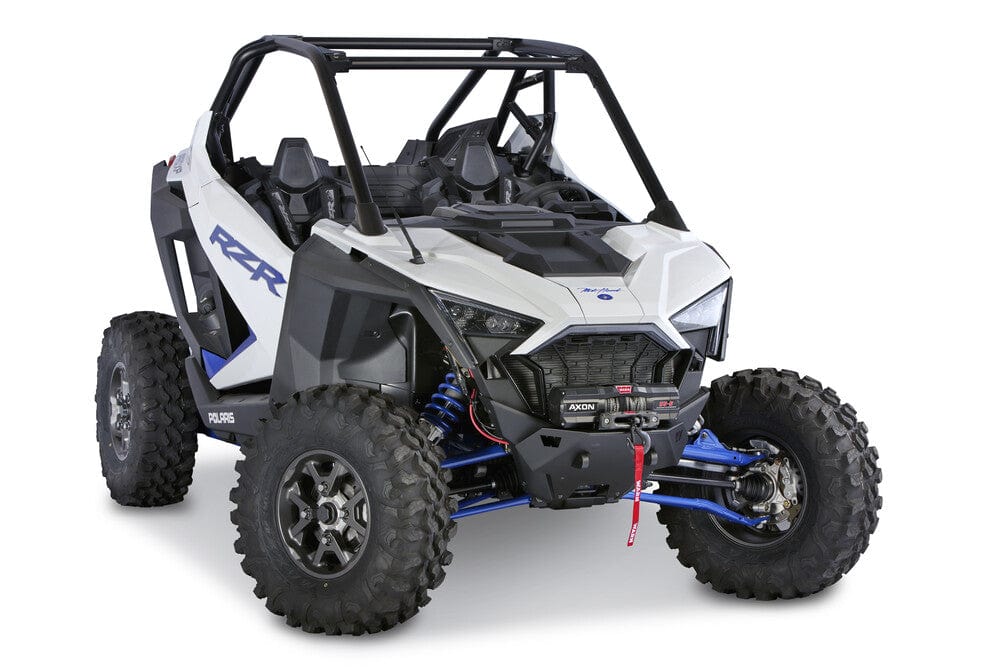 A Polaris RZR Pro XP (2020-2025) equipped with the Warn Front Bumper Winch Mounting Kit, shown from the front left side with large rugged tires, blue suspension arms, open roll cage, and two bucket seats.