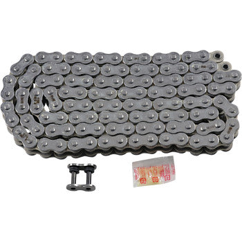The 530 Max Z Drive Chain 120 Links Chrome by Rk, featuring two master links and lubricant, is displayed coiled beside its accessories on a white background.