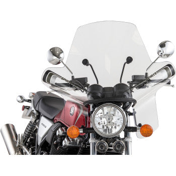 A red and silver motorcycle features a large clear Spirit Windshield by Slipstreamer, round headlight, two side mirrors, and orange turn signals, viewed from the front.