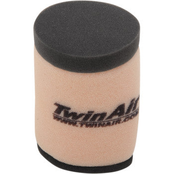 Cylindrical beige foam air filter with black top and bottom edges and Twin Air logo printed in black.