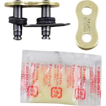 The 520 Max X Connecting Link Clip Gold by RK is a replacement set for bike chains, including two metal link pins with rubber O-rings, a gold MADE IN JAPAN plate, and a small lubricant packet with red text.
