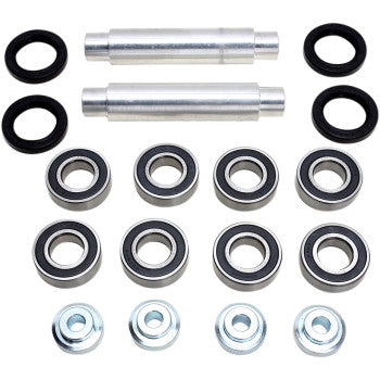 The A-Arm Bearing Kit Back Upper by Pivot Works includes two metal rods, four black rubber rings, eight needle roller bearings, and four silver washers arranged to meet OEM steering control specifications.