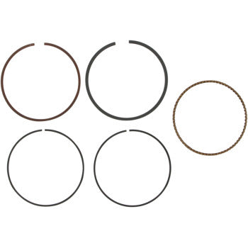 The Ring Set by Wiseco includes five piston rings displayed in two rows on a white background: four solid rings with small gaps and one ring featuring a textured, beaded design.