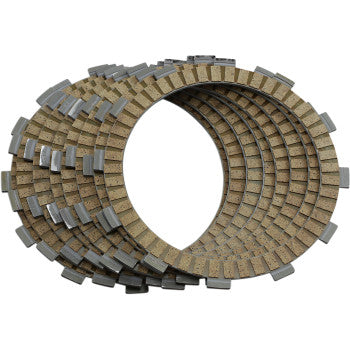 The Clutch Plate Kit Fiber by Hinson Racing features circular, textured clutch plates with metal tabs, neatly stacked in an overlapping pattern—perfect for use with OEM or Hinson clutch baskets.