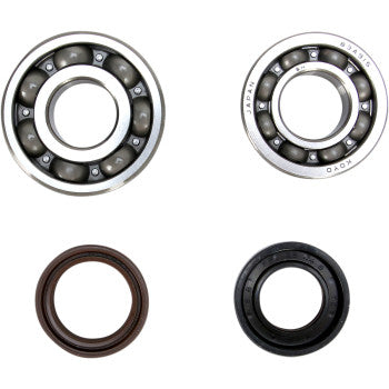 The Yamaha Crank Bearing and Seal Kit by Prox includes two ball bearings and two oil seals, each with a central hole. Arranged in a square on a white background, these parts meet OEM specs—ideal for crankshafts or similar uses.