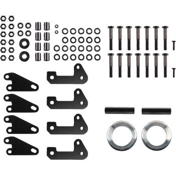 Black metal lift brackets with assorted bolts, nuts, washers, and two silver spacers for off-road vehicle suspension upgrade.