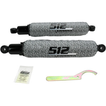 Gray textured metal Progressive Suspension 512 Series front shocks with black mounting ends and adjustment tool.
