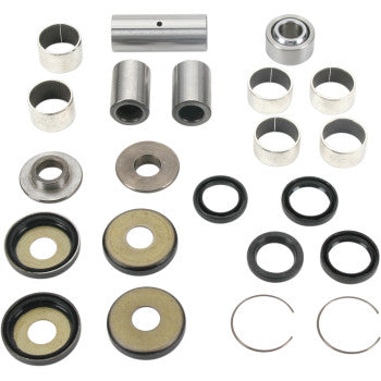 Metal and rubber swingarm linkage bearing kit components including bushings, washers, seals, and circlips arranged in rows.
