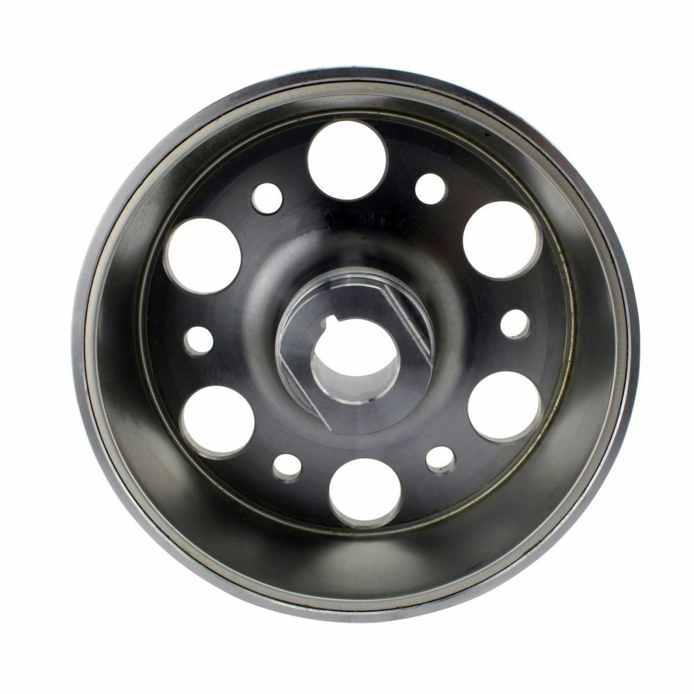 Black circular metal flywheel with multiple round holes and a central hexagonal opening for offroad vehicles.