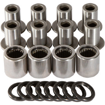 Set of silver cylindrical metal A-arm bearings and black rubber O-rings arranged in rows on white background.