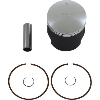 Silver cylindrical piston with black skirt, metal wrist pin, two large piston rings, and two smaller circlips on white.