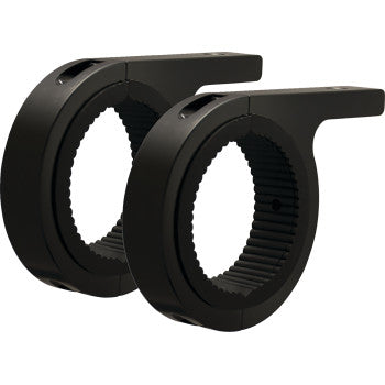The Clamp Mount 3" Pair by Vision X features two black, circular mounts with ribbed inner surfaces, flat extended arms, and rubber inserts for secure, adjustable installation. They are positioned side by side and face the same direction.