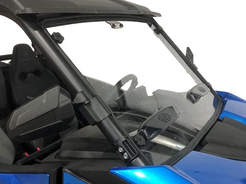 A close-up of a blue off-road vehicle’s cabin shows the CFMOTO Z-Force 800 / 950 Gen 2 Dual Vented Windshield by Spike with black wiper blades and a visible black seat, set against a plain white background for an ultimate off-road vibe.