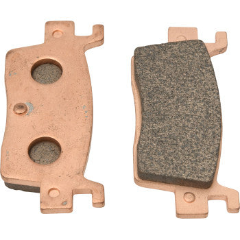 Two Sintered Brake Pads by All Balls are shown side by side; one reveals the smooth metal backing with two holes, while the other displays the textured friction surface known for excellent stopping power.