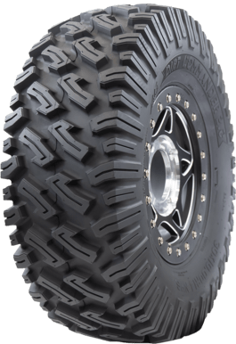 The Tire Dirt Commander 2.0 Radial 33X10R15 by GBC features deep, aggressive treads and a black rim with metallic bolts, offering superior grip and durability on rough terrain with enhanced sidewall protection.