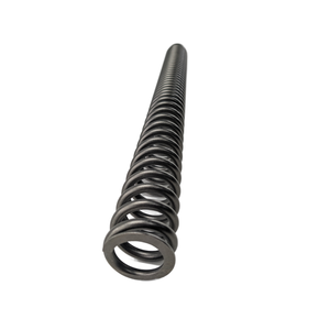 Long black metal coil spring with evenly spaced tight loops and smooth finish, used for motorcycle suspension.