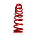 Bright red metal shock spring coil with consistent circular loops and glossy finish.
