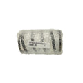 Black metal shock spring wrapped in protective bubble wrap with a visible label on the packaging.