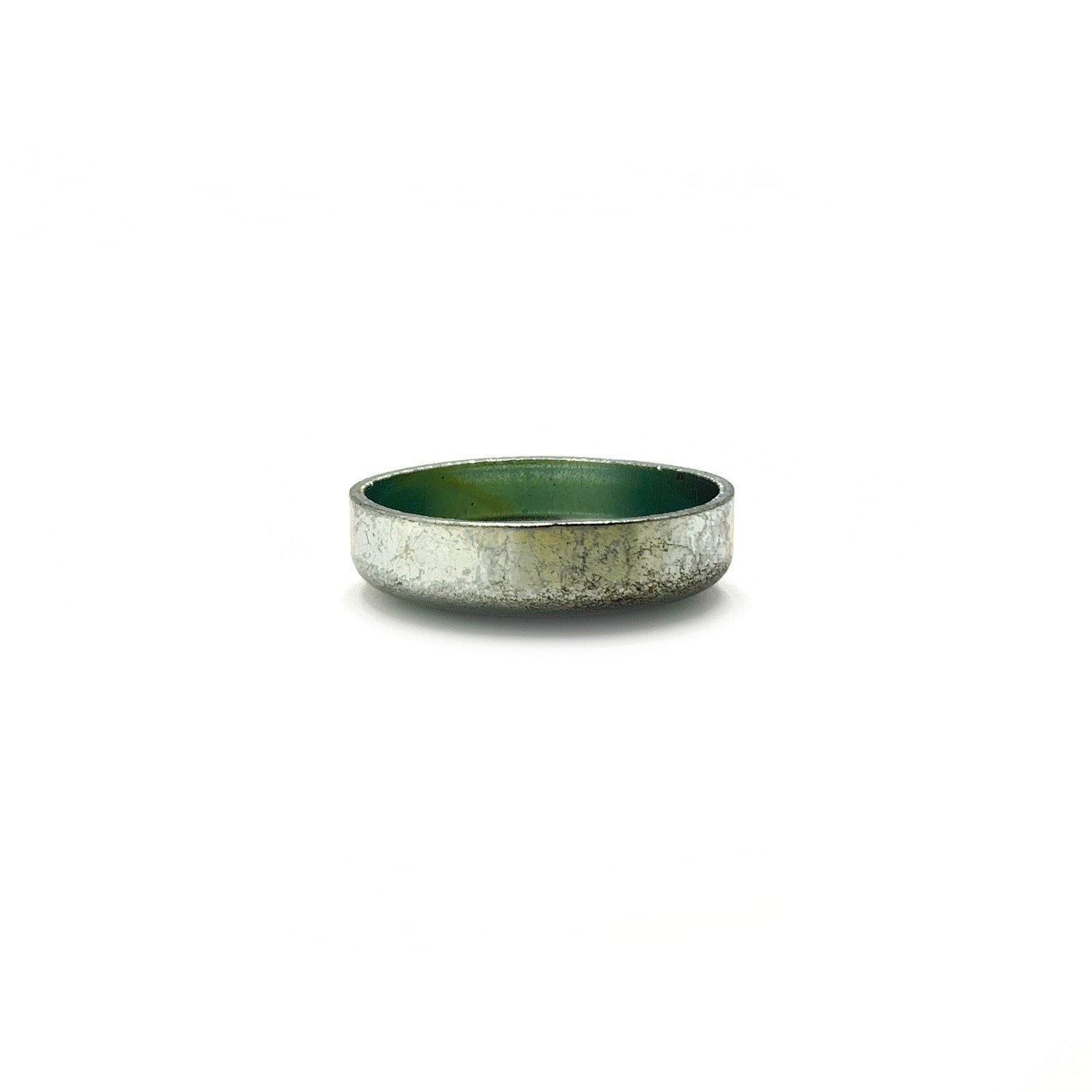 Round metal expansion plug with silver exterior and smooth green interior coating.