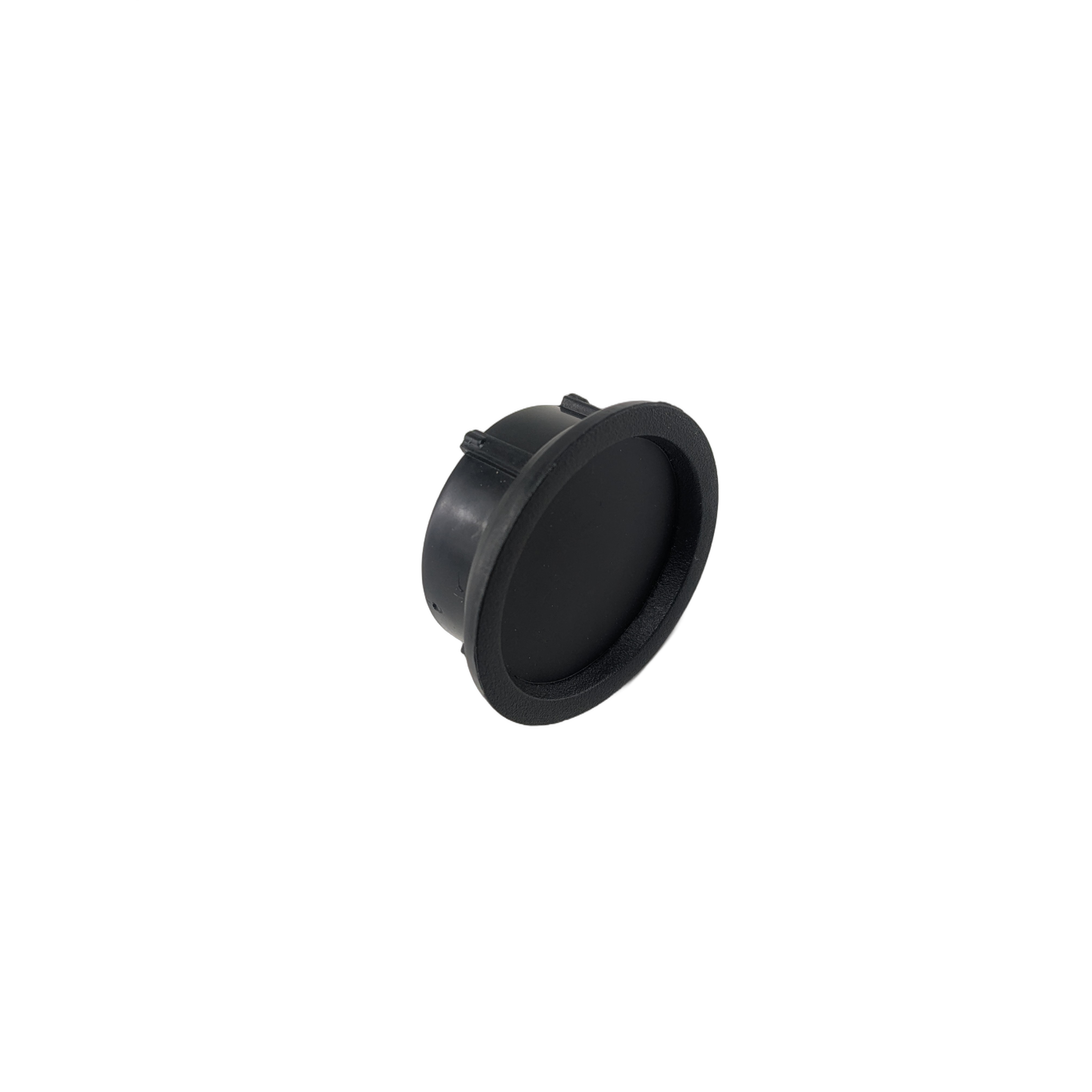 Black circular plastic steering cap with a slightly raised edge and a textured grip surface.