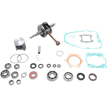 Complete engine rebuild kit with crankshaft, piston, gaskets, seals, and bearings in silver and copper tones.