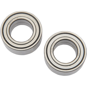 The Honda TRX Wheel Bearing Kit Rear by Pivot Works features two silver, double-sealed ball bearings with central circular openings, designed for precise steering and braking control. Displayed on a white background with polished surfaces and distinct rings.
