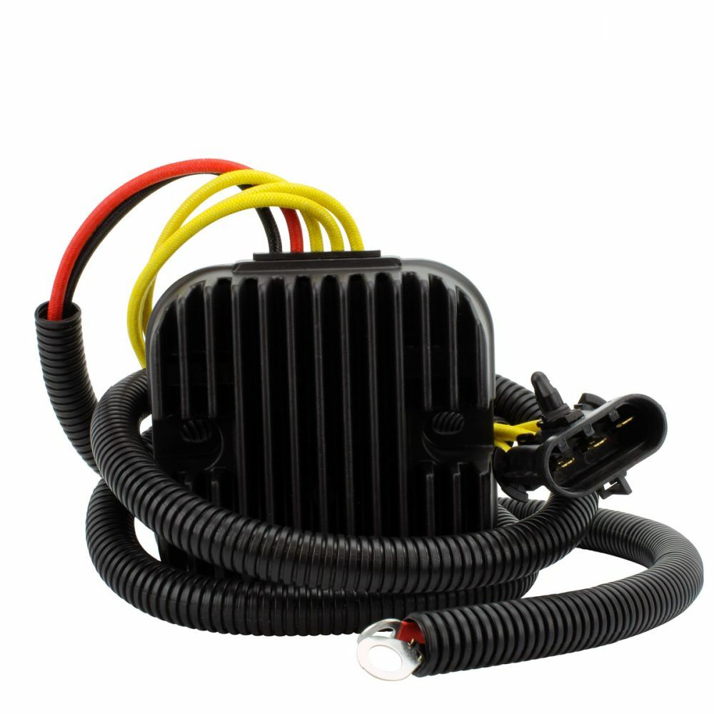 Black rectangular finned aluminum regulator with attached black corrugated wire loom and red, yellow, and black electrical.