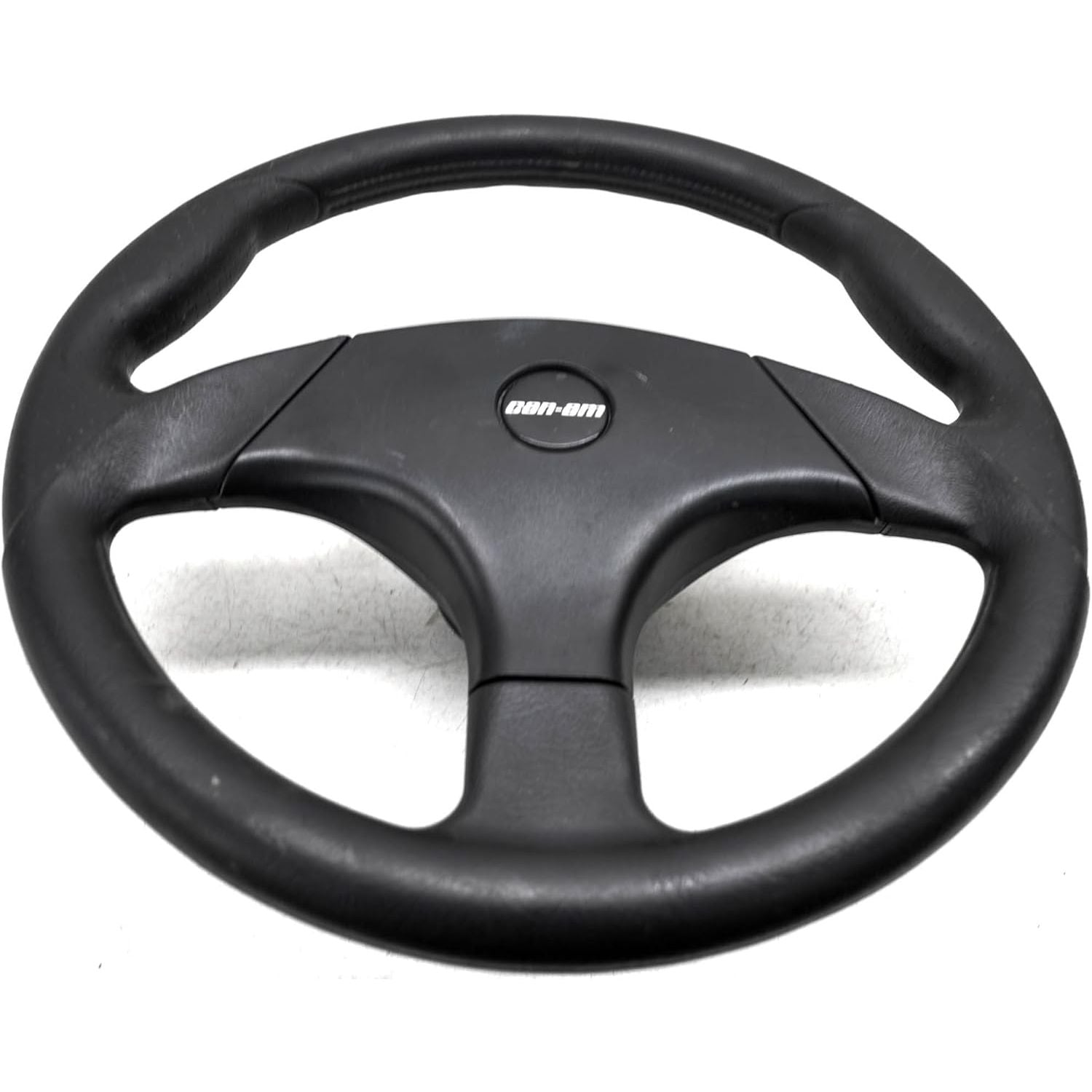 Black rubber steering wheel with three-spoke design and Can-Am logo center badge.