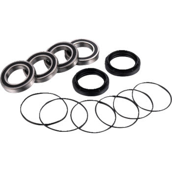 The Axle Bearing Kit Rear by Factory Links includes four metal ball bearings with dust seals, two black rubber seals, and six slim black rings, arranged on a white background—perfect for off-road wheel bearing replacement.