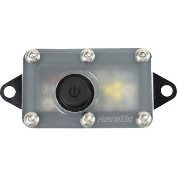 The Dome Light LED Diffused by Heretic features a sturdy CNC aluminum rectangular housing, a black central power button, six silver screws along the edges, and a translucent cover that reveals the internal components. "Heretic" appears faintly at the lower right.