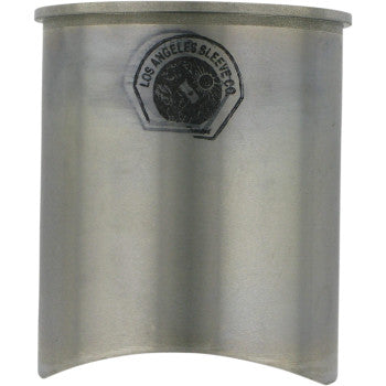 The Kawasaki Cylinder Sleeve 85.00 mm by La Sleeve is a metallic cylindrical sleeve with a partial base cutout, ideal for cylinder resleeving, and features the Los Angeles Sleeve Co. logo near the top.