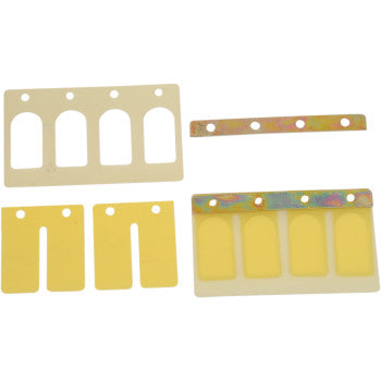 The Can-Am Power Reed Set by Boyesen includes five thin, flat dual-stage reeds in assorted shapes and sizes, such as rectangles with cutouts and a metallic strip with round holes, designed for enhanced performance.