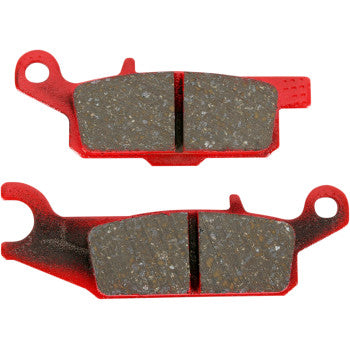 Red metal Sport Carbon brake pads with dark friction surface and central groove, designed for offroad use.