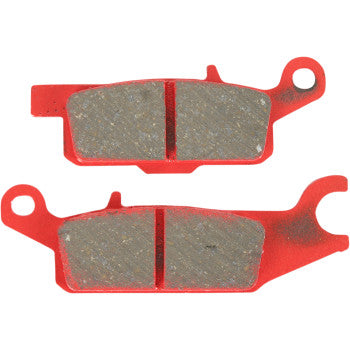 Red metal sport carbon brake pads with textured friction surface and mounting holes, designed for offroad use.